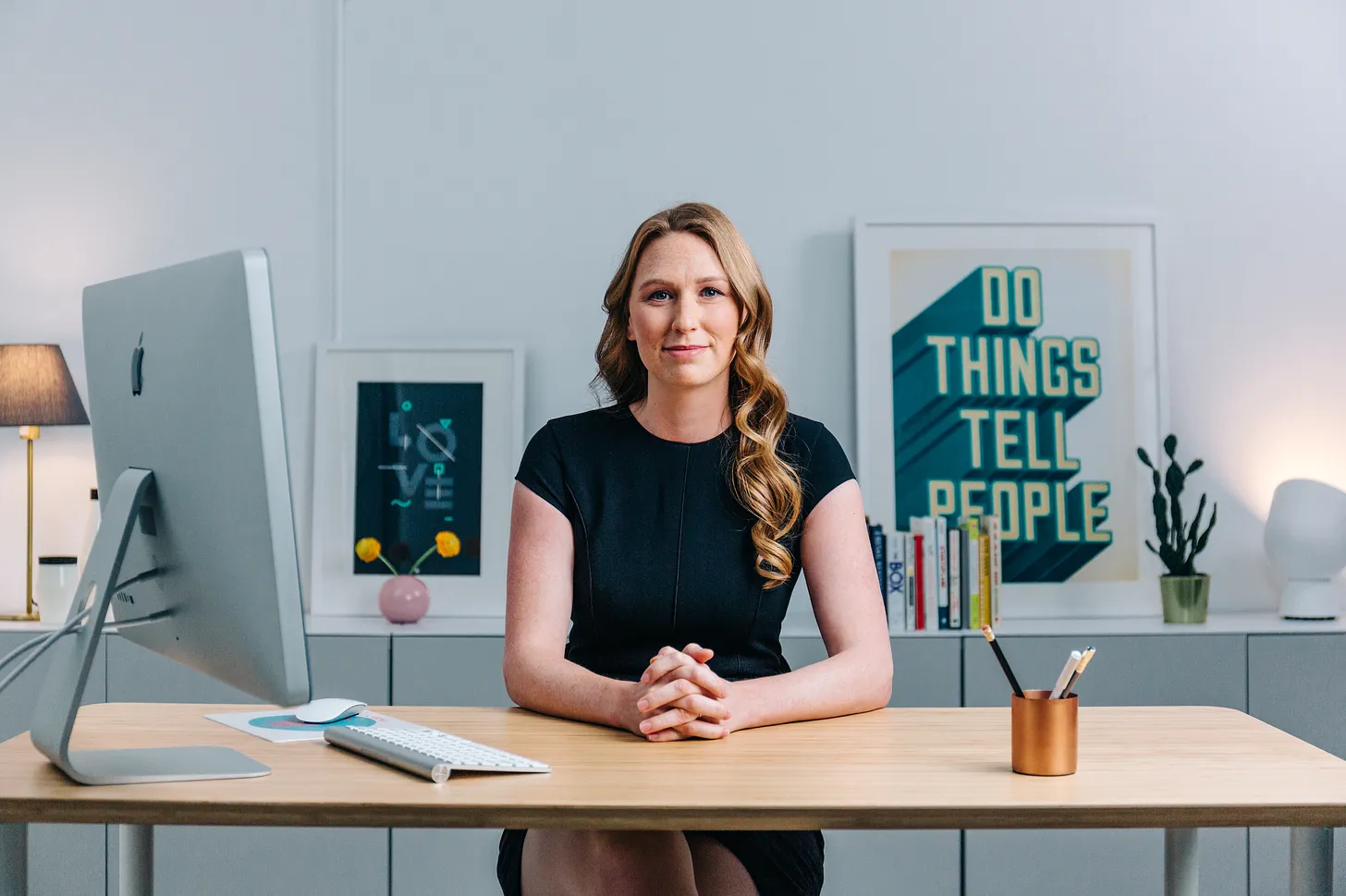 Casandra Campbell - Professional headshot in modern office